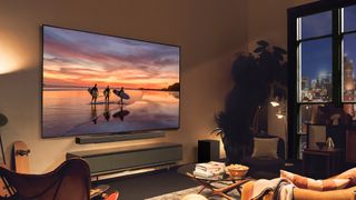 LG G4 OLED, our pick for the best 75-inch OLED TV, displaying a sunset scene in a modern living room