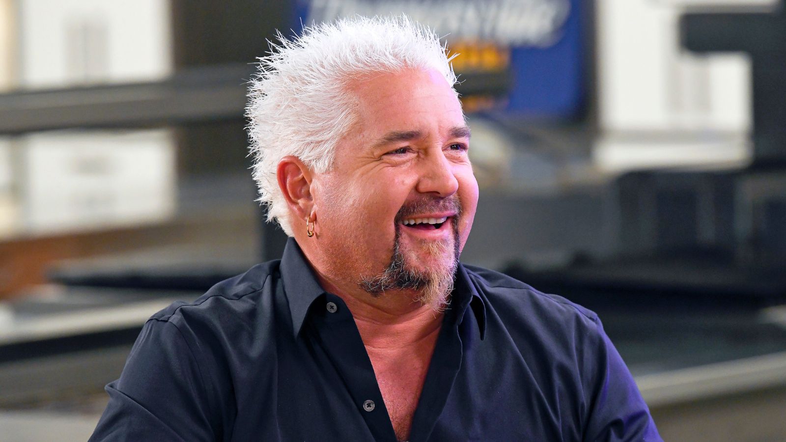 guy fieri on a plain background