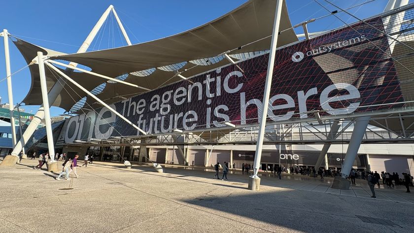 An image of the entrance to OutSystem&#039;s ONE event showing the text The agentic future is here