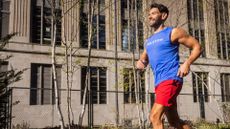 Men running in a Peloton vest