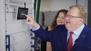 My wife Rachel and I inspect the new Rohde & Schwarz R&S TE1 liquid-cooled transmitter, which is significantly reducing our overall energy costs.