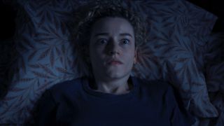Julia Garner as Justine in bed in Weapons