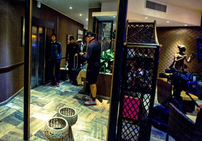 The team arrives at their hotel