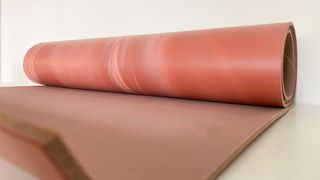 Lululemon Reversible 5mm Yoga Mat partially rolled up