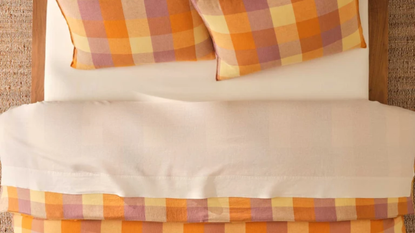 Brooklinen plaid bedding for fall 2026 styled with clean ivory sheets in a neutral bedroom