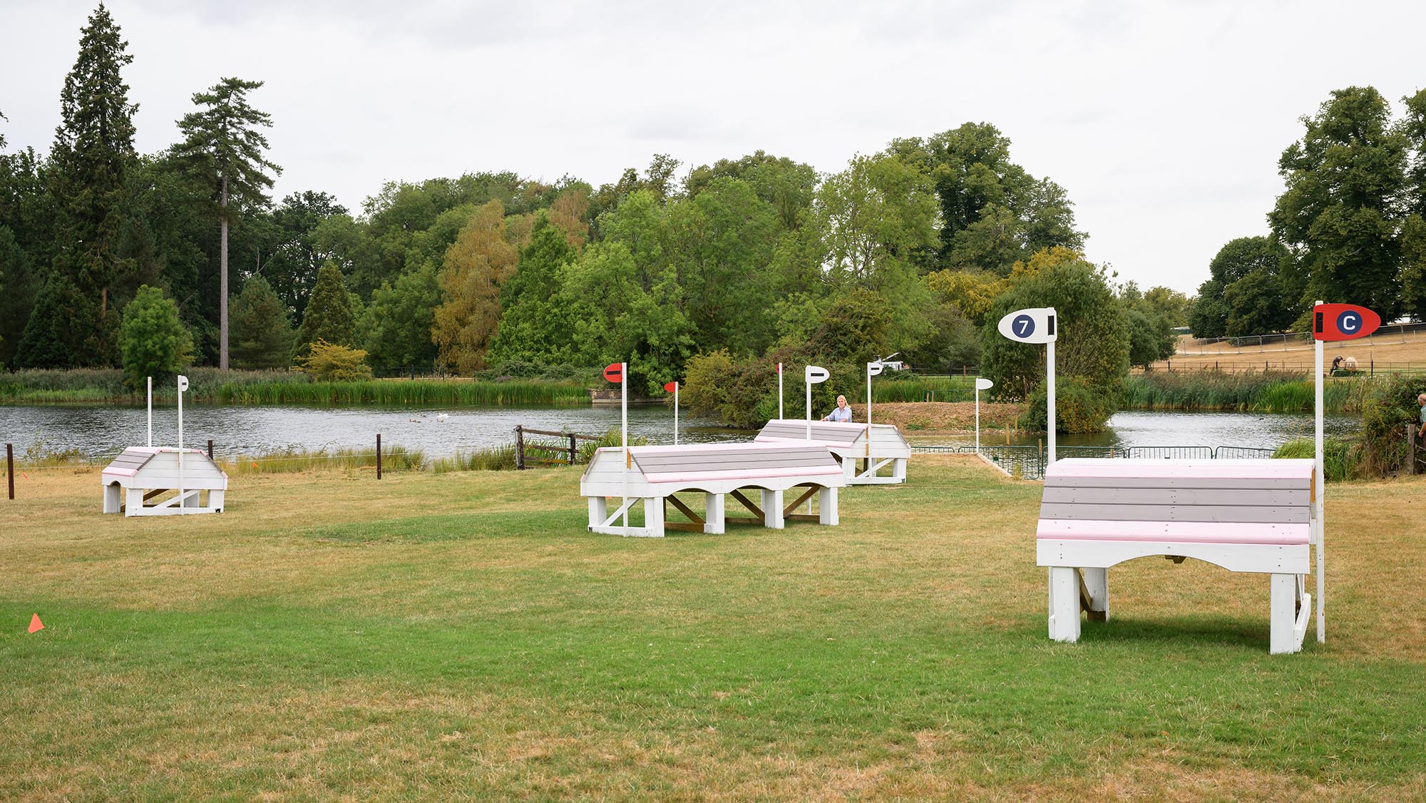 Several pink and white house fences on the Burghley cross-country course 2026
