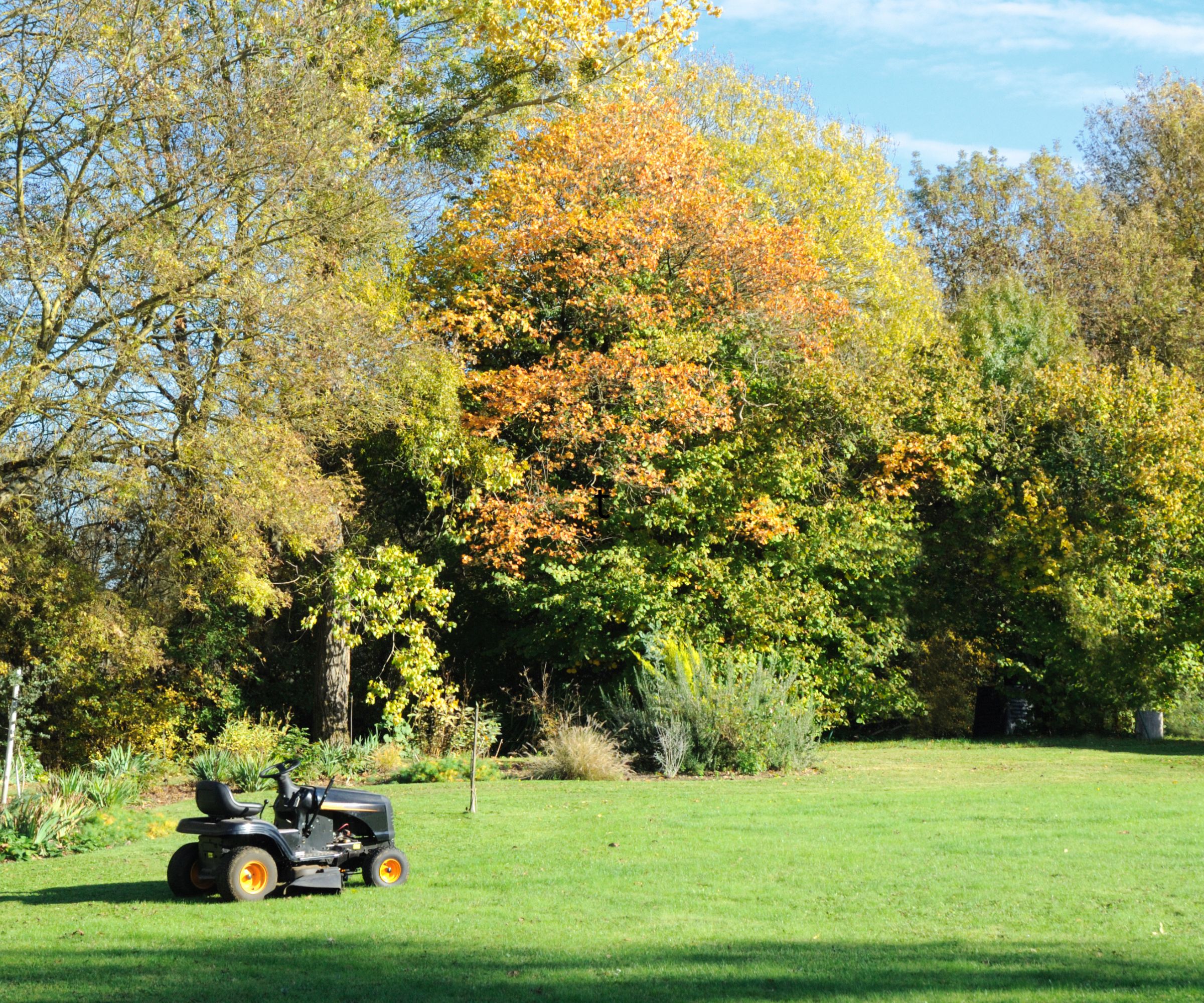 A tractor mower on a lawn