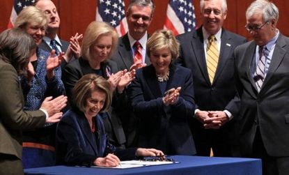 Nancy Pelosi signs legislation repealing "don't ask, don't tell," Tuesday. the fourth legislative victory for Democrats during the lame-duck Congress.