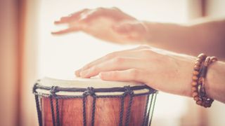 Hand drums being played