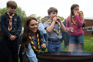 Kate Middleton with her children Prince Louis and Princess Charlotte making s'mores