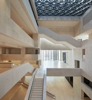 interior showing main atrium and staircases with view of different floor levels
