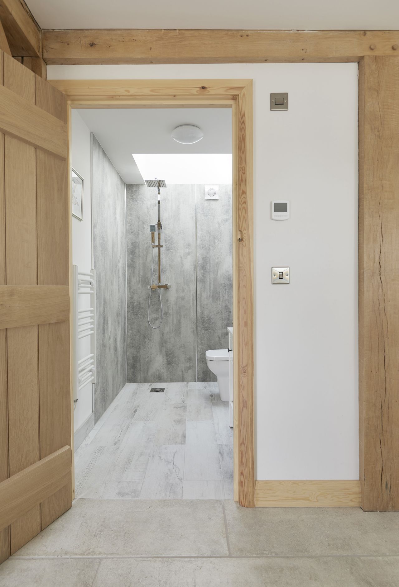 modern bathroom shower in oak frame home