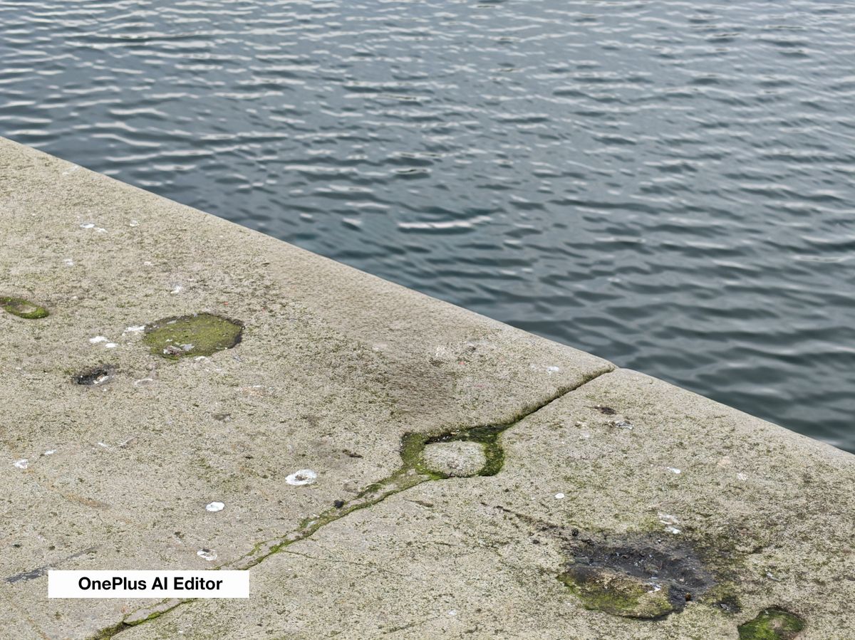 A stone wall near some water