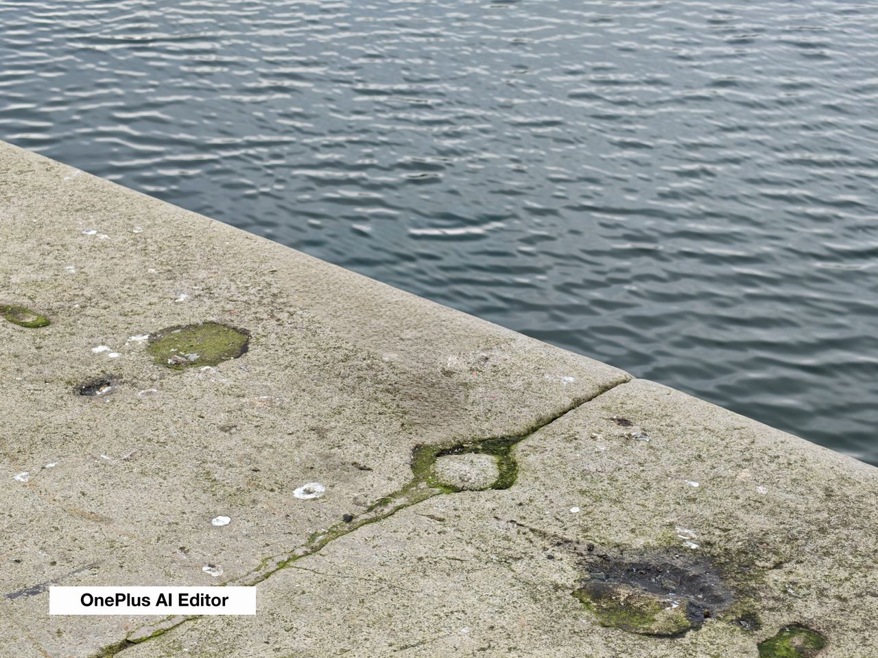 A stone wall near some water