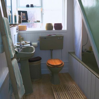 bathroom with wooden floor and bathtub