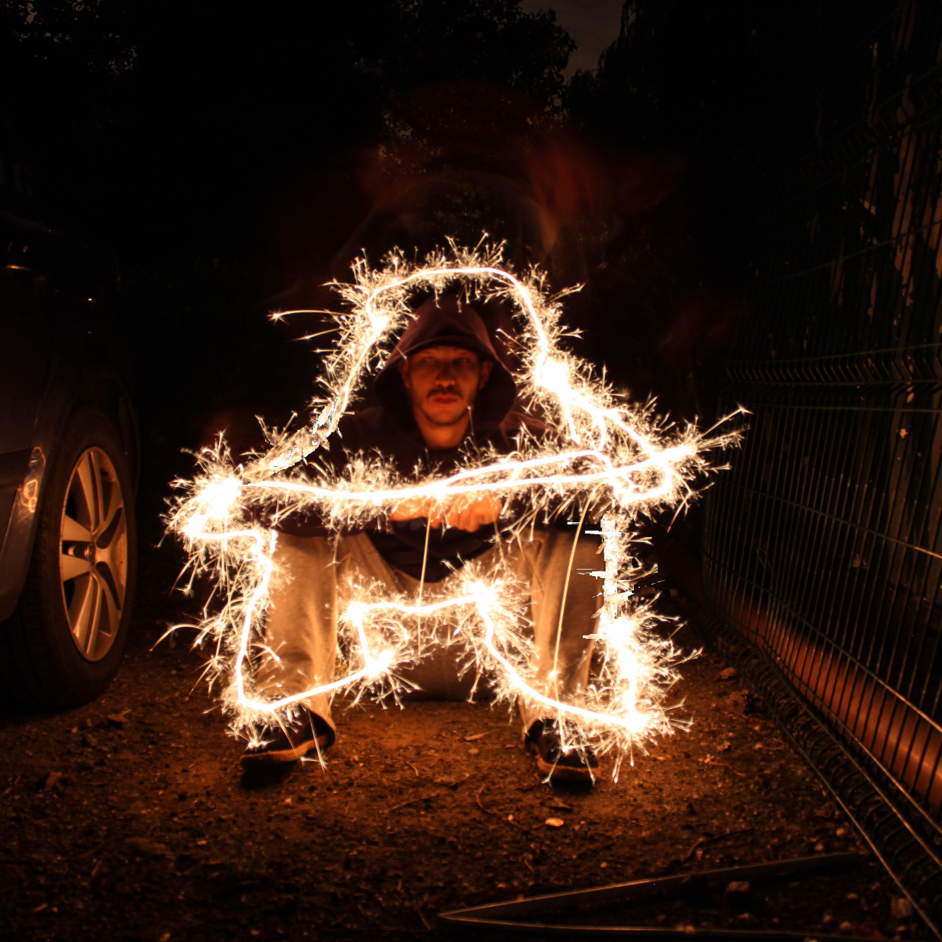 photographer making a steel wool picture in the dark