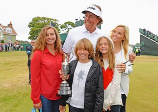 Phil and his family hold the Claret Jug