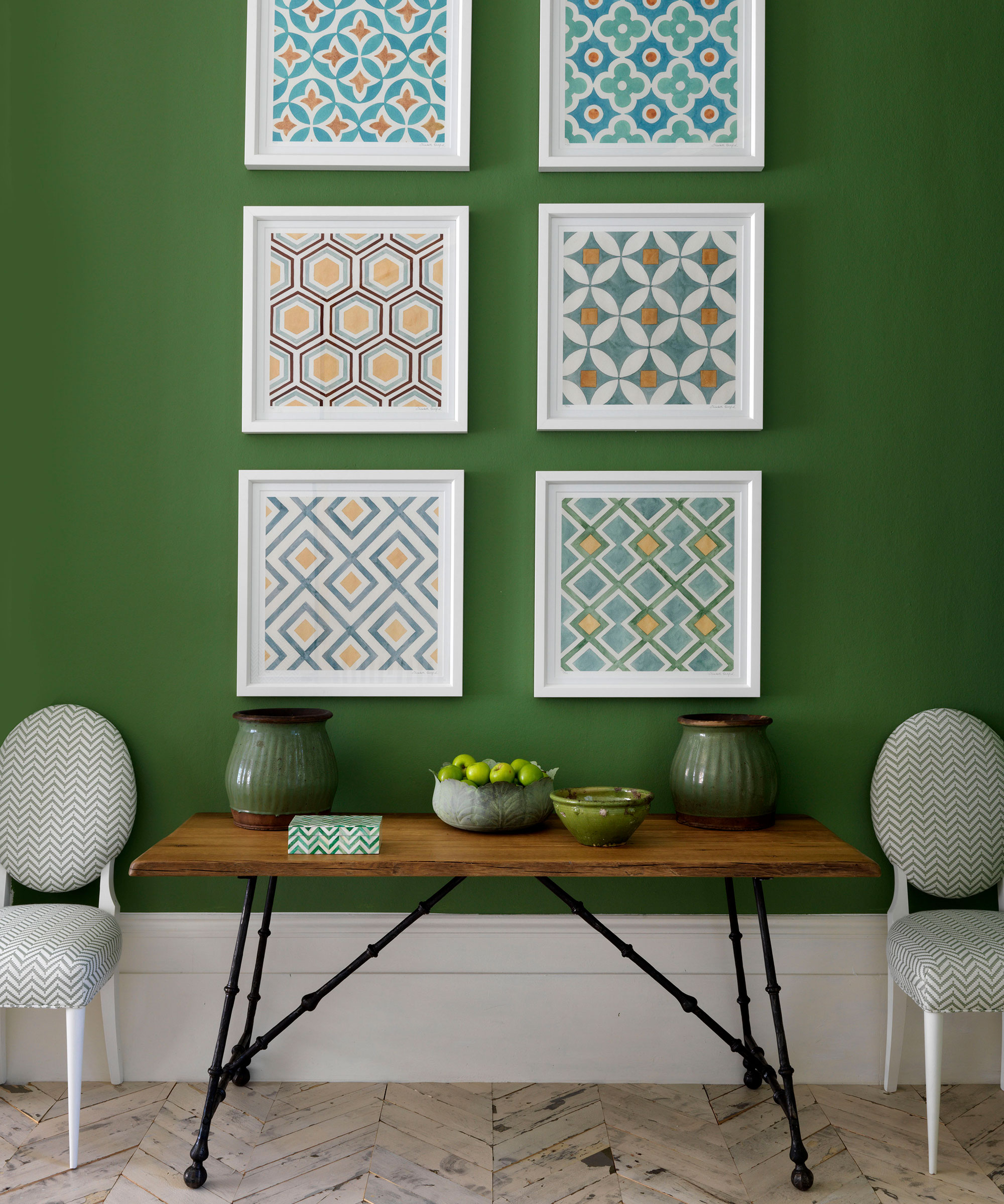 Green hallway with wood flooring and bench