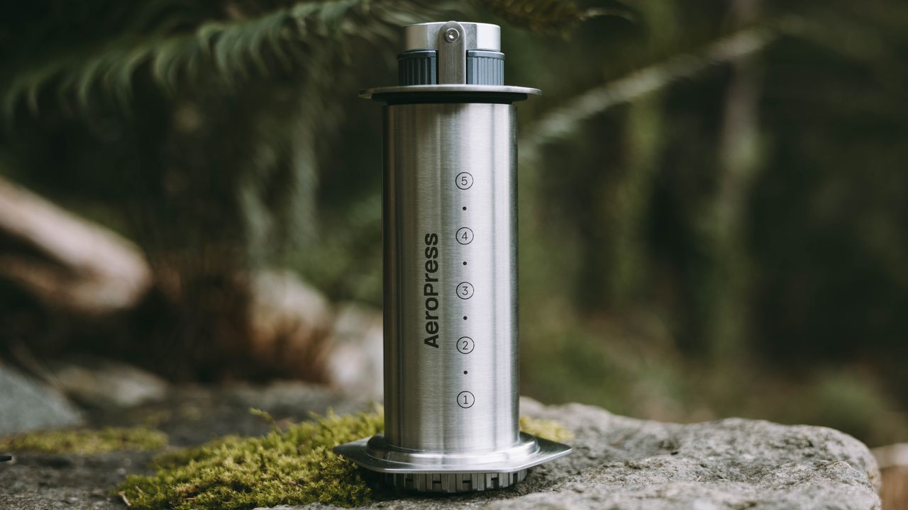 AeroPress Steel coffee maker with manual coffee grinder inside