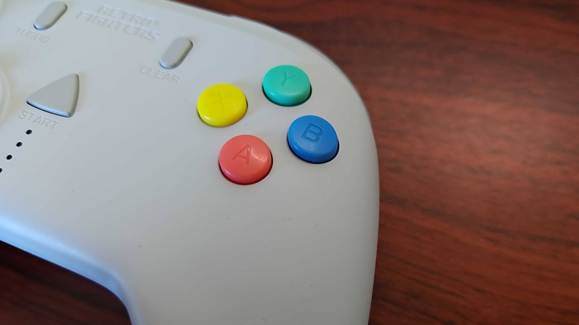 Close up of Retro Fighters StrikerDC Dreamcast controller face butons.