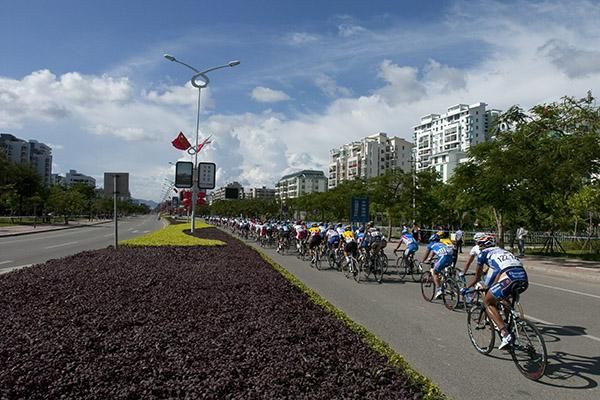 The peloton head along the streets of Sanya during the opening stage criterium.