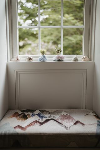 A close-up of a window sill with crystals