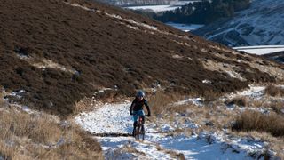 Mountain bikers riding in snow