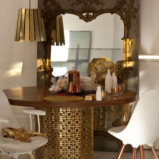 dining area with mirror and pendant