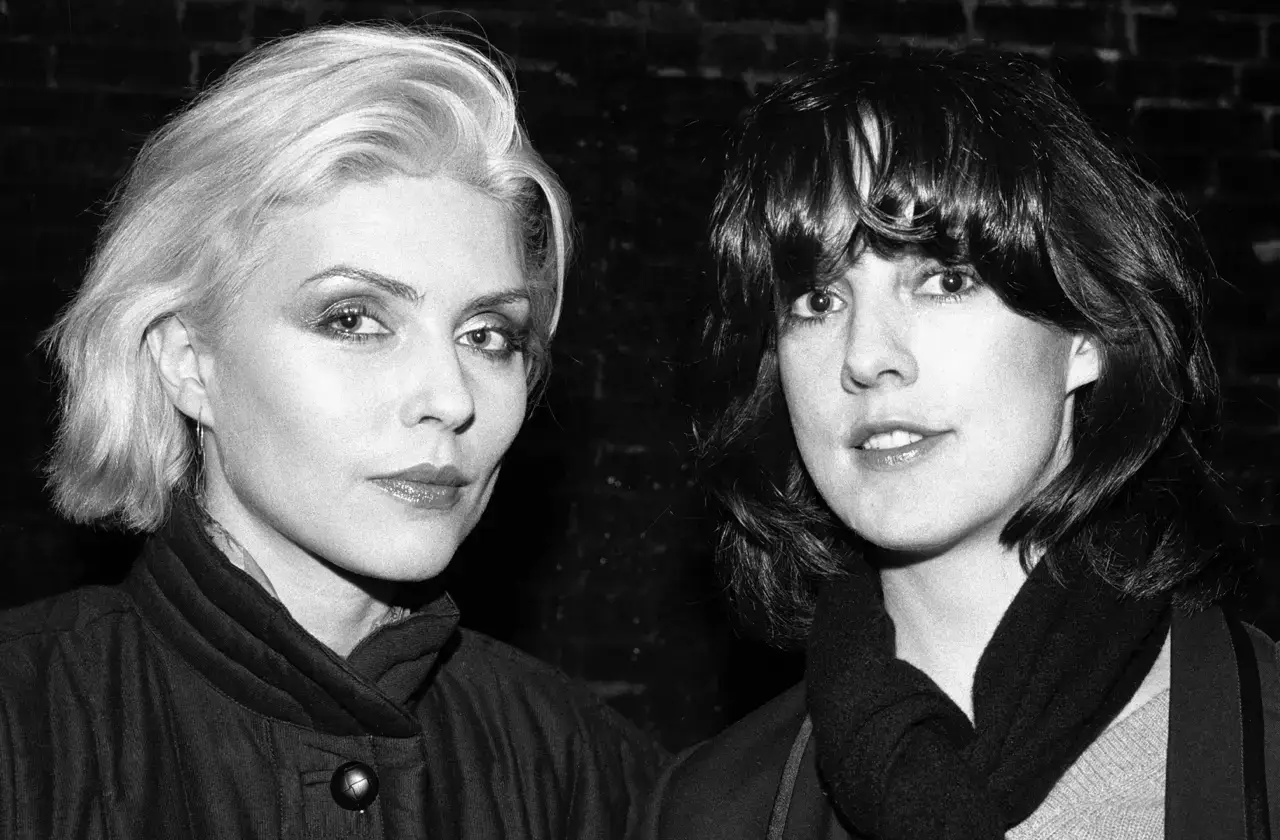 Two women looking at camera from close up.