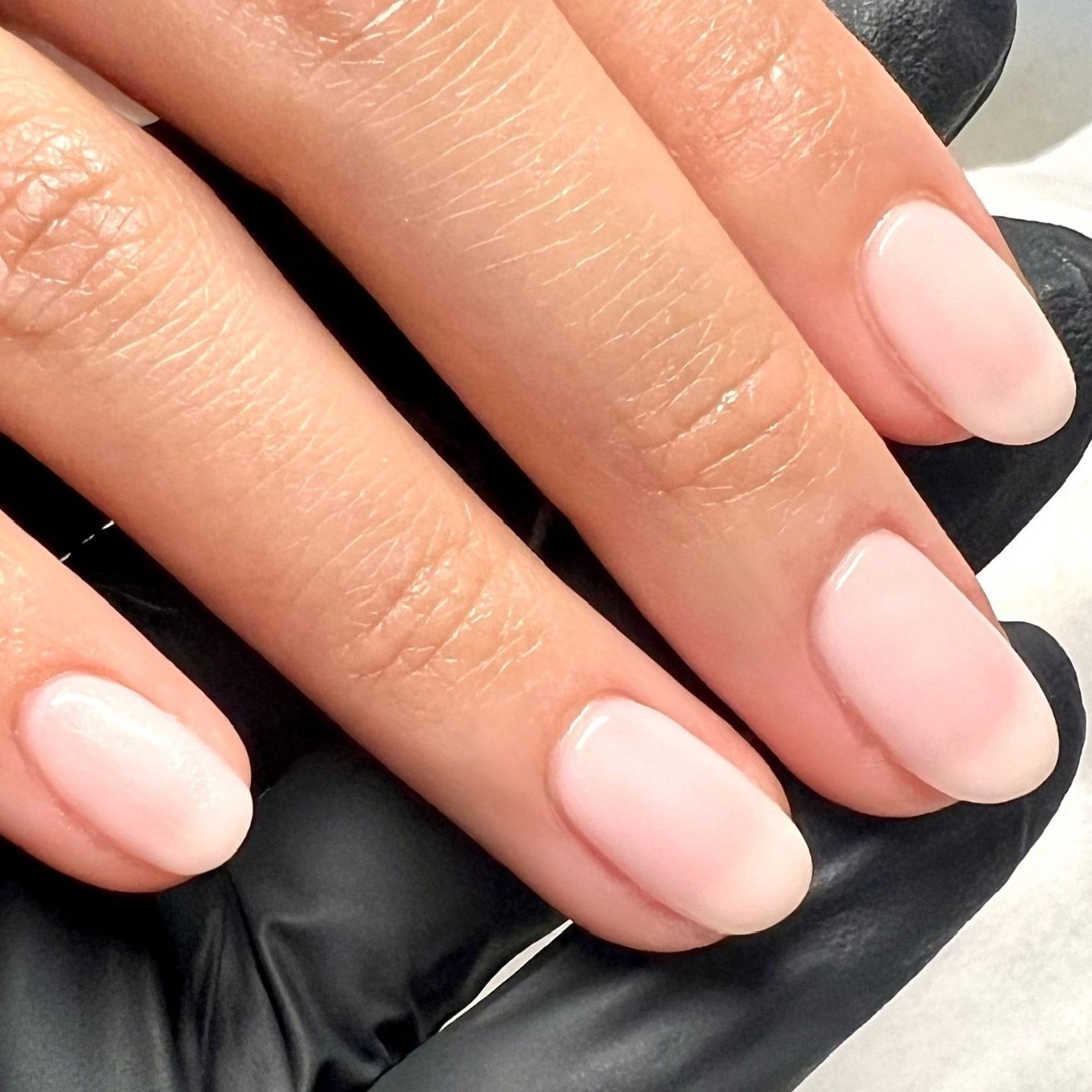 Almond-shaped nails with a blurred French manicure design