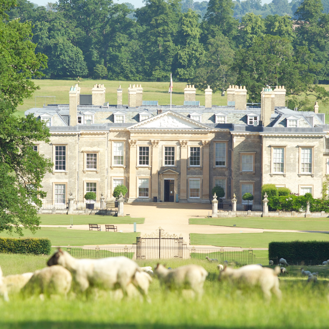 The exterior of Althorp House with sheep in the foreground