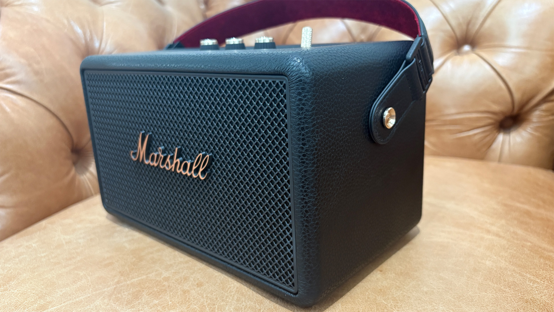 Marshall Kilburn III wireless speaker in light brown leather armchair