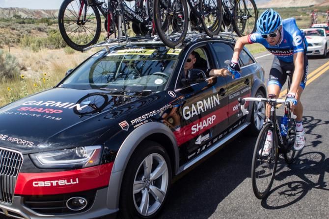 Ryder Hesjedal (Garmin-Sharp) loads up on bottles to bring to the team.