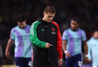 Martin Odegaard of Arsenal shows dejection after the Premier League match between Fulham FC and Arsenal FC at Craven Cottage on December 08, 2024 in London, England