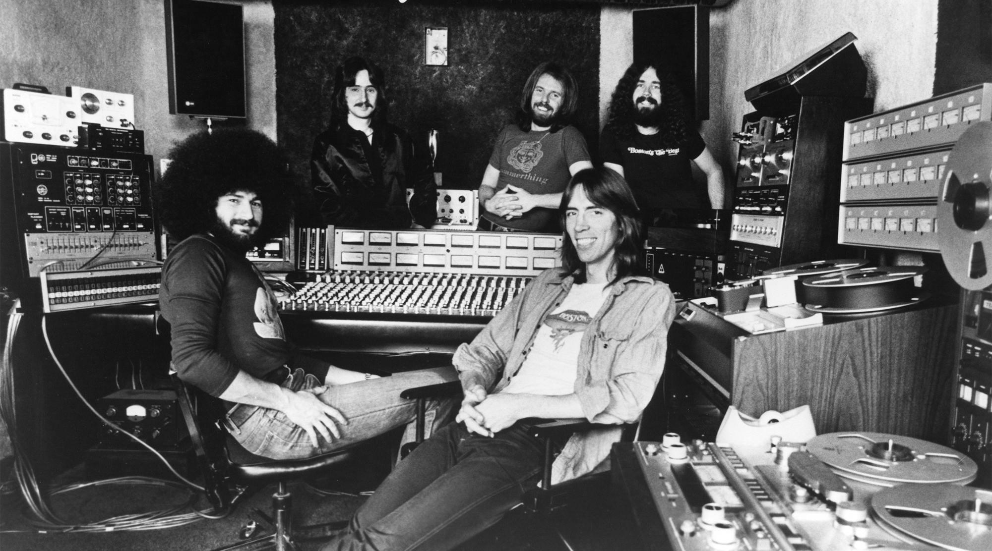 CIRCA 1977: (Back row, L-R) Barry Goudreau, Fran Sheehan, Brad Delp, (front row, L-R) Sib Hashian and Tom Scholz of the rock group 'Boston' pose for a portrait in the studio in circa 1977.