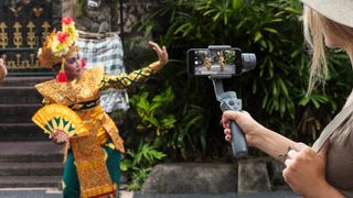 DJI Osmo 2 being used to video a Thai dancer with a smartphone