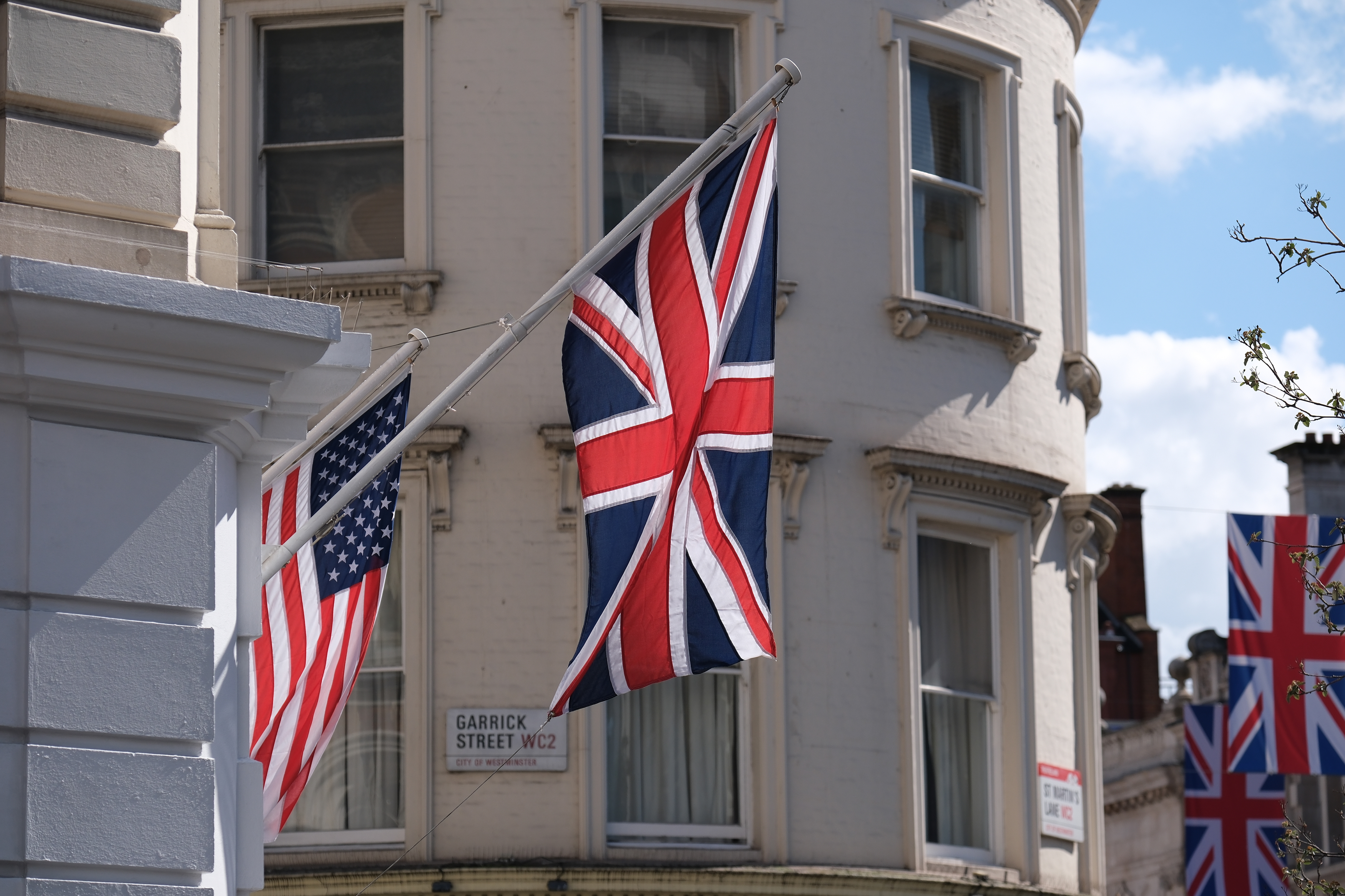 A union jack flag hanging from a building