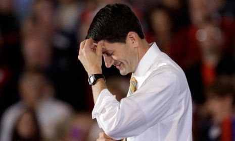 Paul Ryan pauses while speaking at a rally at Oakland University in Rochester, Mich. Last year, the GOP congressman pumped some iron for a TIME photoshoot.