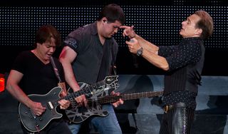 (left to right) Eddie Van Halen, Wolfgang Van Halen and David Lee Roth perform at the AT&T Center on June 22, 2012 in San Antonio, Texas