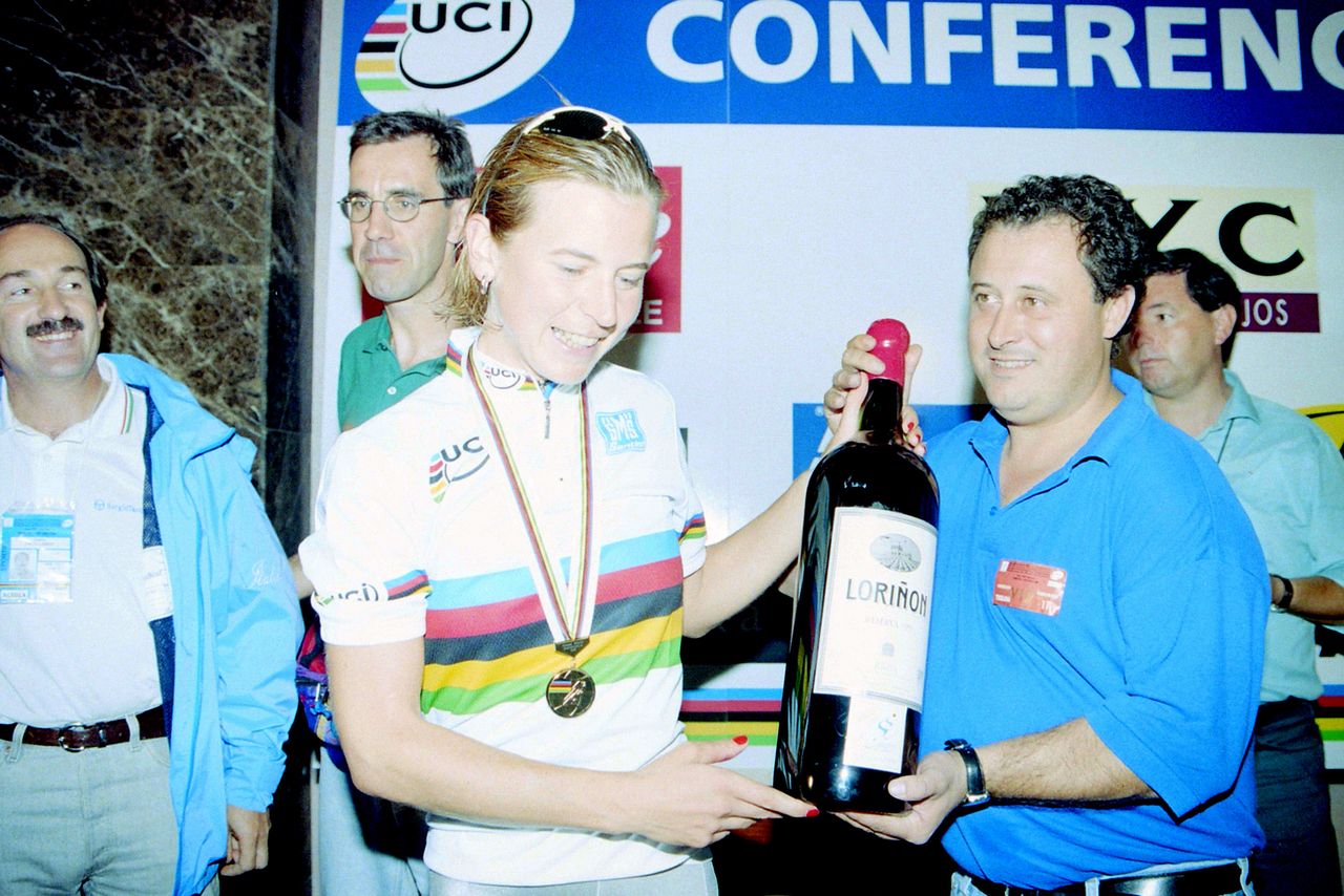 1997 road race winner Alessandra Cappellotto gets large bottle of wine for her efforts, and a rainbow jersey