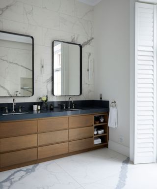 An example of bathroom storage ideas showing a bathroom with a wooden vanity unit in a Georgian townhouse in London