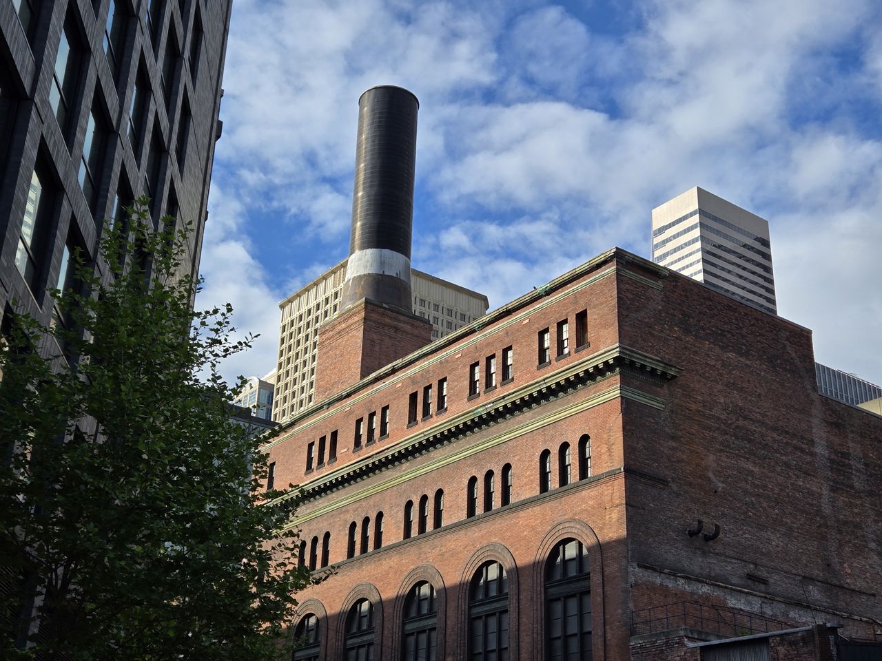 A brick building with a smokestack on top