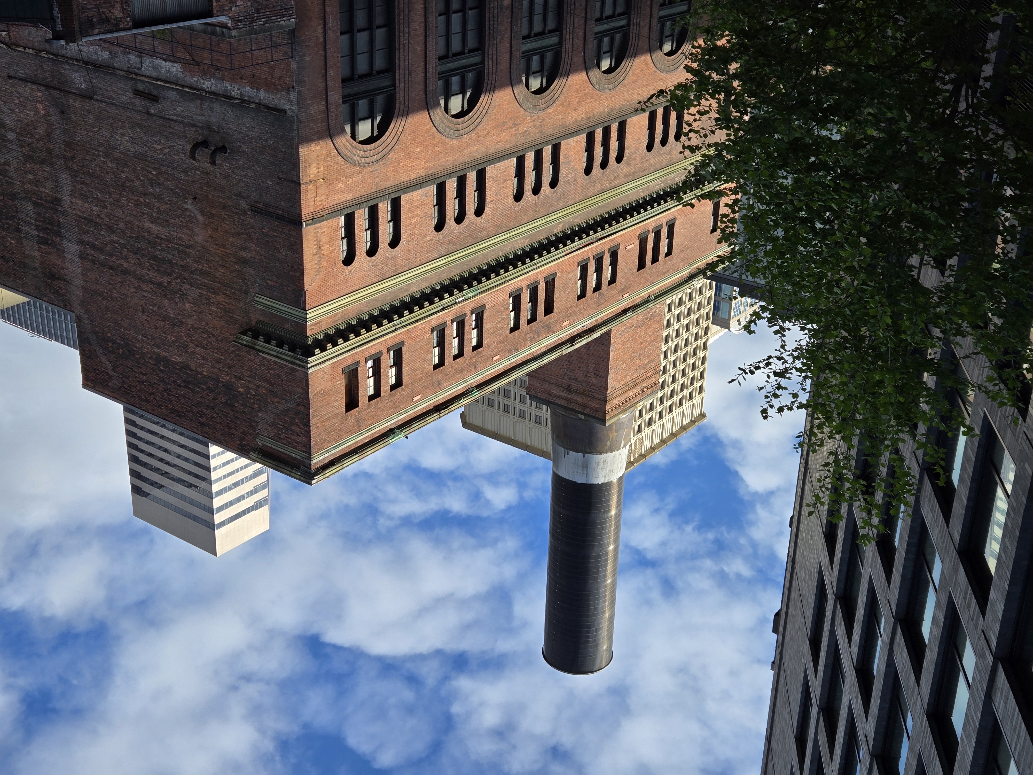 A brick building with a smokestack on top