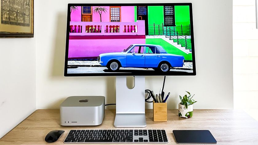 Mac Studio on a desk plugged into a Studio Display