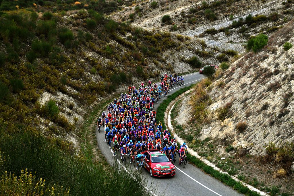 VINUESA SPAIN OCTOBER 22 Richard Carapaz of Ecuador and Team INEOS Grenadiers Polka Dot Mountain Jersey Daniel Martin of Ireland and Team Israel StartUp Nation Green Points Jersey Primoz Roglic of Slovenia and Team Jumbo Visma Red Leader Jersey Enric Mas Nicolau of Spain and Movistar Team White Best Young Jersey Peloton Landscape during the 75th Tour of Spain 2020 Stage 3 a 1661km stage from Lodosa to La Laguna Negra Vinuesa 1735m lavuelta LaVuelta20 La Vuelta on October 22 2020 in Vinuesa Spain Photo by Justin SetterfieldGetty Images