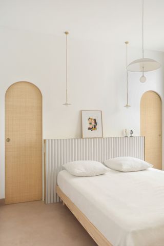 A small bedroom painted white