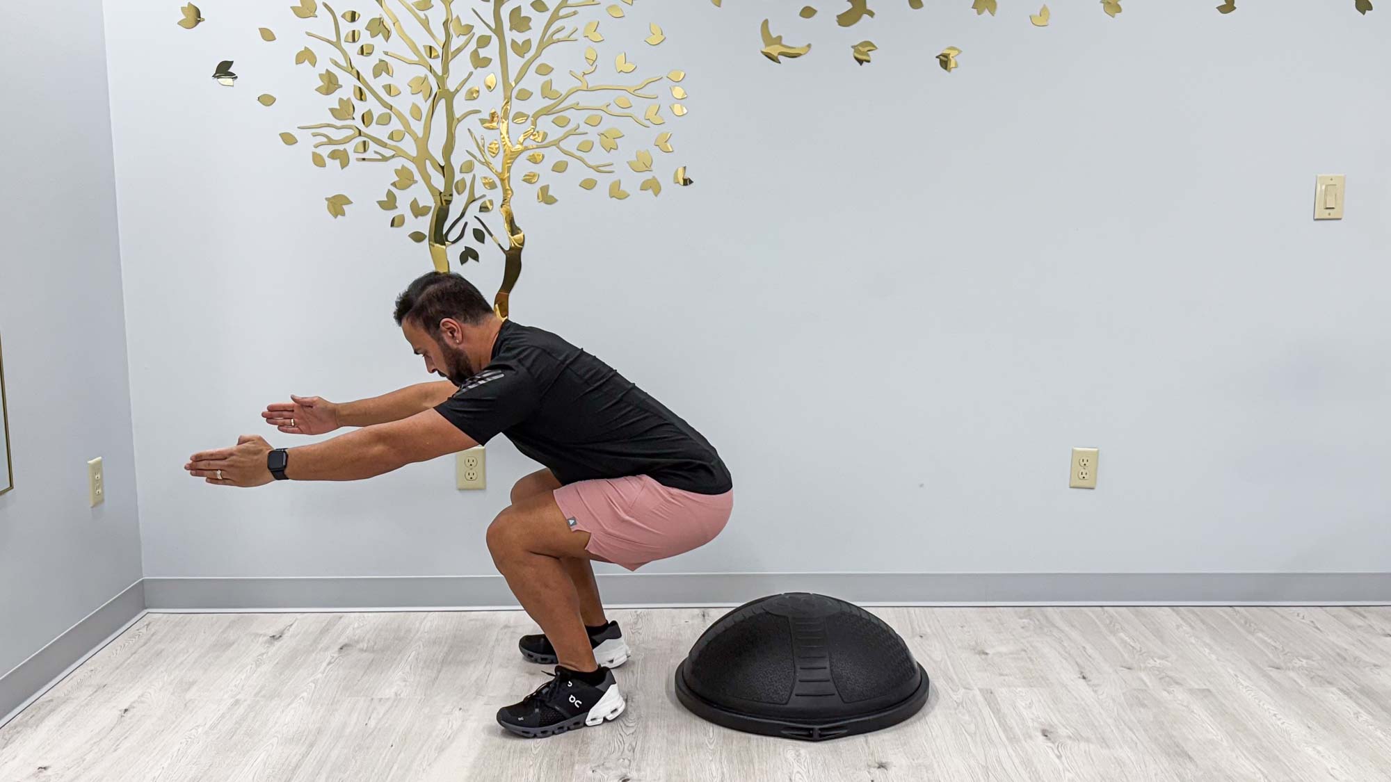 Nico Gonzalez completing the BOSU dead bug to stand exercise