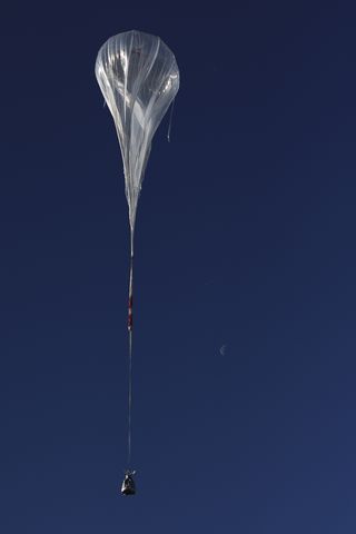 The balloon ascends during the first manned test flight for Red Bull Stratos in Roswell, New Mexico on March 15, 2012.
