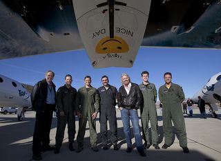 Burt, Sir Richard and the Virgin Galactic team celebrate their success following the first drop and glide test of SpaceShipTwo on Oct. 10, 2010.