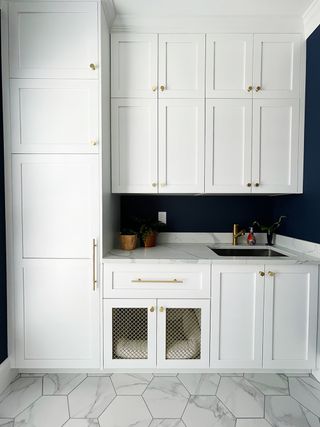 Laundry room with Ikea cabinets and white shaker doors by Semihandmade